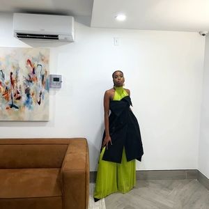 A floor-length, backless jumpsuit with a halter neck; wide legs;comfortable fit.